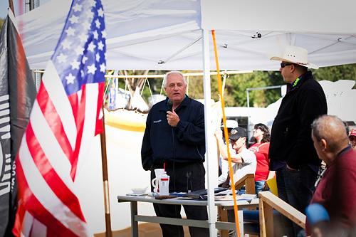 OPE电子竞技官网 president Randy Schmailzl stands with a microphone in his hand